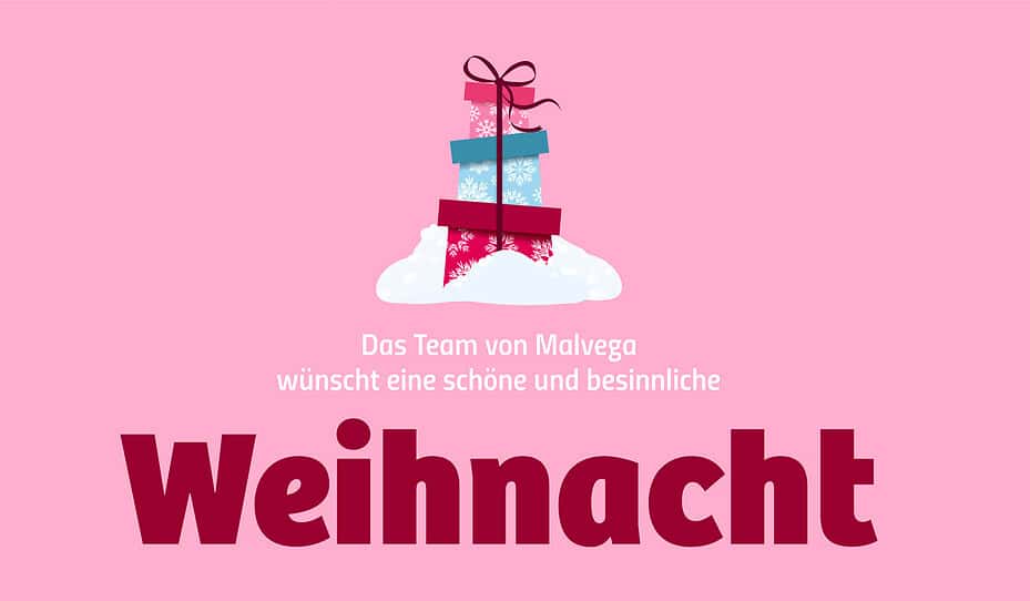 Drei gestapelte Geschenkboxen mit Schnee und einem rosa Hintergrund. Der Text lautet: Das Team von Malvega wünscht eine schöne und besinnliche Weihnacht.